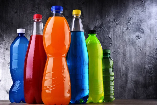 Plastic bottles of assorted carbonated soft drinks — Stock Photo, Image