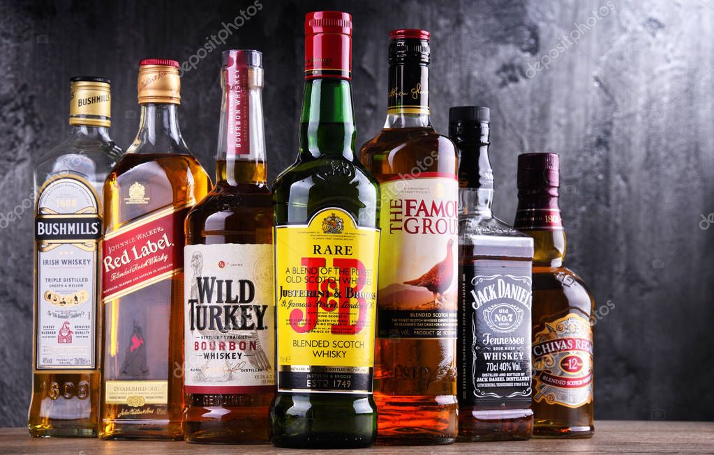 POZNAN, POLAND - MAR 30, 2018: Bottles of several global whiskey brands, the most popular liquor in the world.