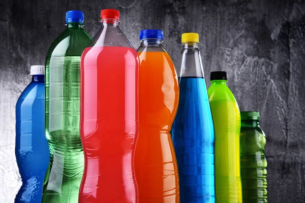 Plastic bottles of assorted carbonated soft drinks — Stock Photo, Image