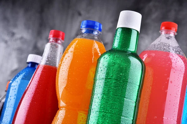 Plastic bottles of assorted carbonated soft drinks Royalty Free Stock Images