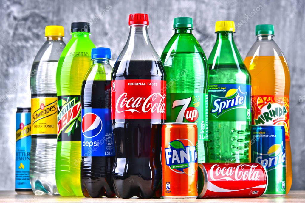 POZNAN, POLAND - APR 6, 2018: Bottles of global soft drink brands including products of Coca Cola Company and Pepsico
