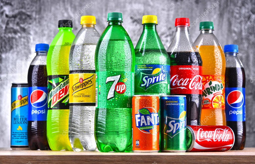 POZNAN, POLAND - APR 6, 2018: Bottles of global soft drink brands including products of Coca Cola Company and Pepsico