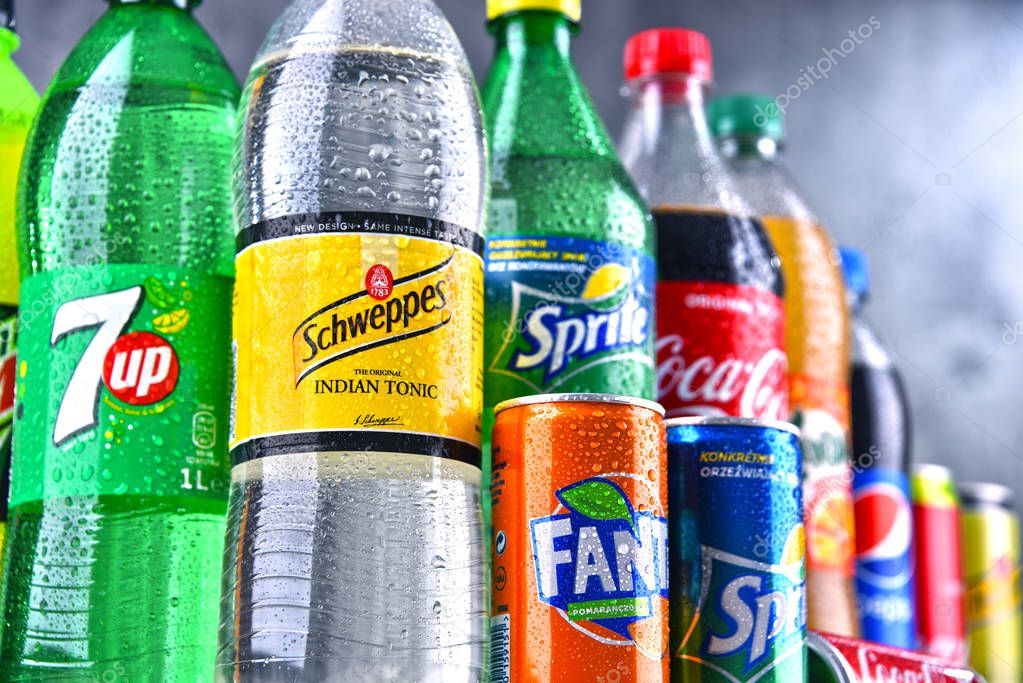 POZNAN, POLAND - APR 6, 2018: Bottles of global soft drink brands including products of Coca Cola Company and Pepsico