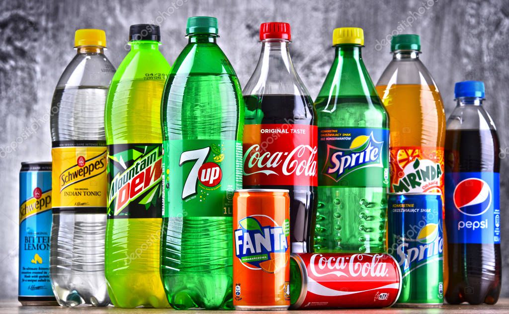 POZNAN, POLAND - APR 6, 2018: Bottles of global soft drink brands including products of Coca Cola Company and Pepsico