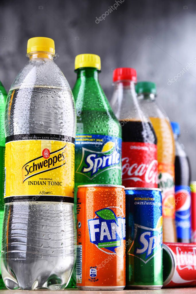 POZNAN, POLAND - APR 6, 2018: Bottles of global soft drink brands including products of Coca Cola Company and Pepsico