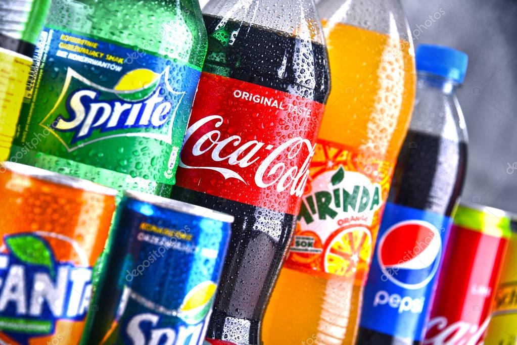 POZNAN, POLAND - APR 6, 2018: Bottles of global soft drink brands including products of Coca Cola Company and Pepsico