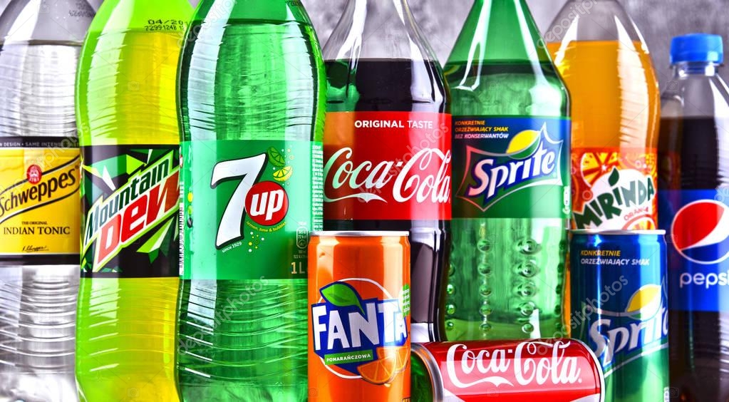 POZNAN, POLAND - APR 6, 2018: Bottles of global soft drink brands including products of Coca Cola Company and Pepsico