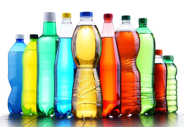 Plastic bottles of assorted carbonated soft drinks — Stock Photo, Image