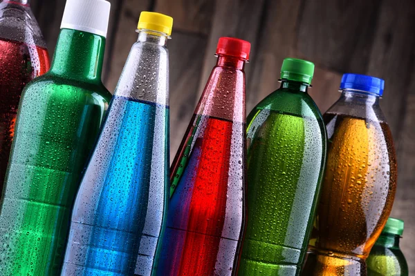 Plastic bottles of assorted carbonated soft drinks — Stock Photo, Image