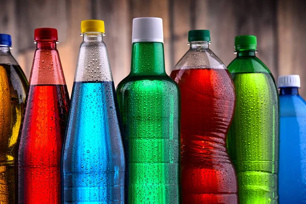 Plastic bottles of assorted carbonated soft drinks — Stock Photo, Image