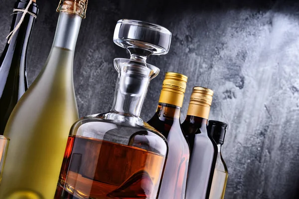 Carafe and bottles of assorted alcoholic beverages. — Stock Photo, Image