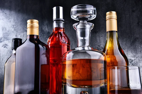 Carafe and bottles of assorted alcoholic beverages. — Stock Photo, Image