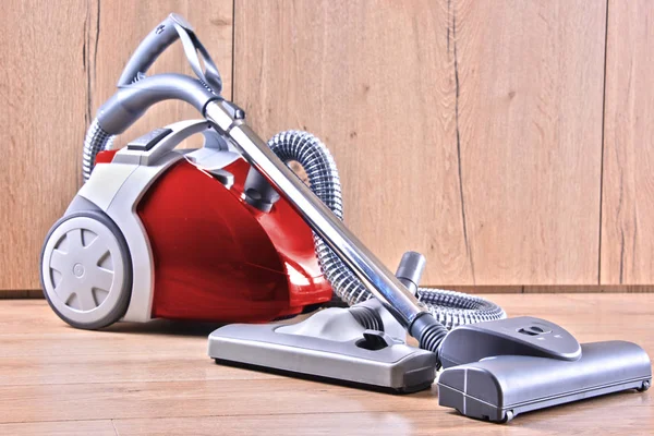 Canister vacuum cleaner for home use on the floor panels — Stock Photo, Image