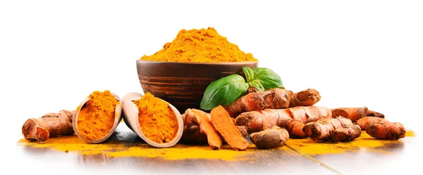 Bowl of turmeric powder over white background — Stock Photo, Image