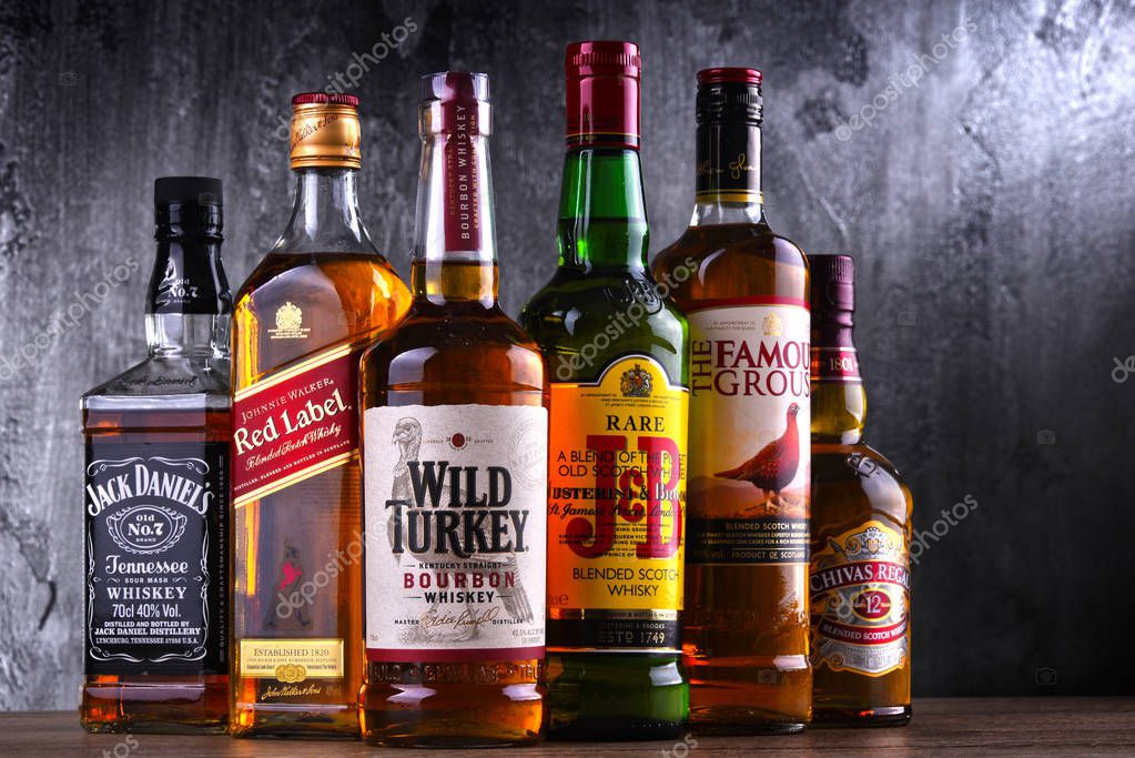 POZNAN, POLAND - MAR 30, 2018: Bottles of several global whiskey brands, the most popular liquor in the world.