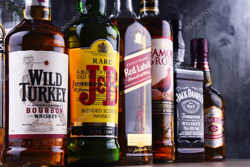 POZNAN, POLAND - MAR 30, 2018: Bottles of several global whiskey brands, the most popular liquor in the world.