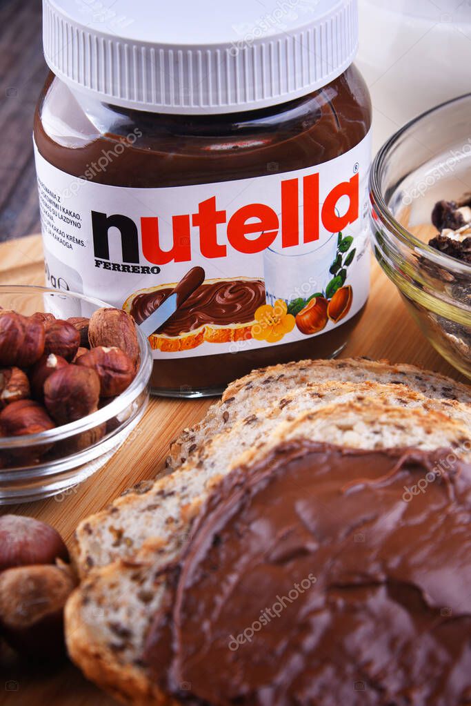 POZNAN, POL - OCT 31, 2019: Jar of Nutella, a widely popular brand name of a sweetened hazelnut cocoa spread, introduced to the market in 1964 by Italian company Ferrero.