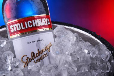 Bottle of Stolichnaya vodka in bucket with crushed ice clipart