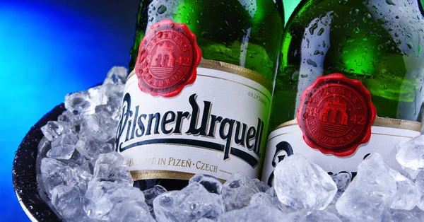 Bottles of Pilsner Urquell beer in bucket with crushed ice — Stock Photo, Image