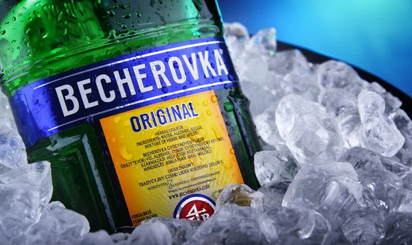 Bottle of Becherovka bitters in bucket with crushed ice — Stock Photo, Image