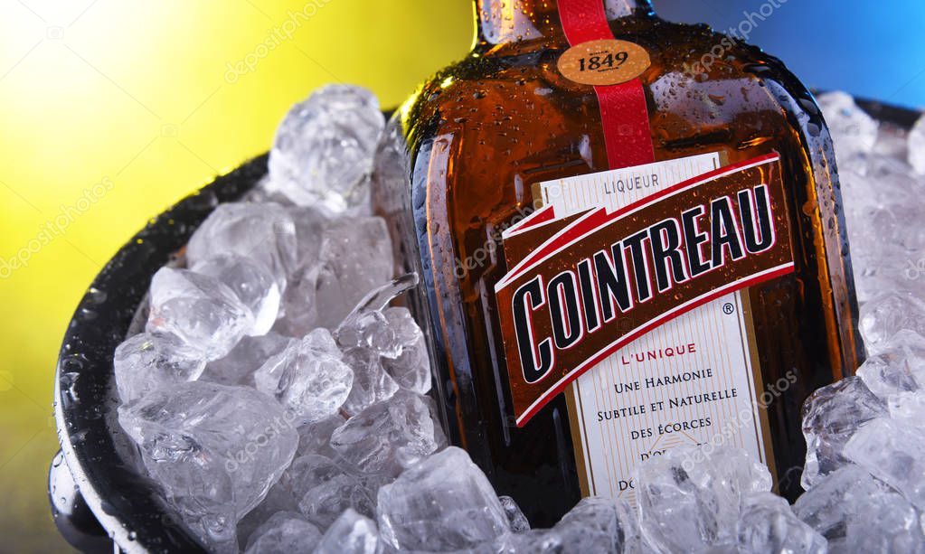 POZNAN, POL - NOV 21, 2019: Bottle of Cointreau, a brand of French triple sec (an orange-flavoured liqueur); great component of several well-known cocktails, also drunk as an aperitif and digestif