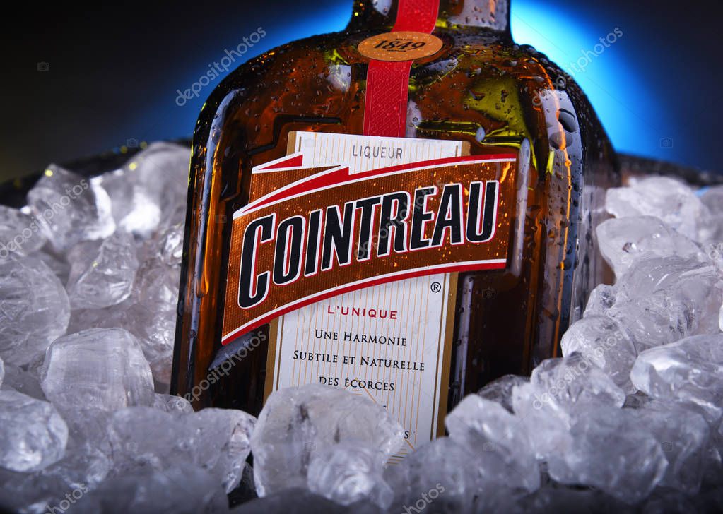 POZNAN, POL - NOV 21, 2019: Bottle of Cointreau, a brand of French triple sec (an orange-flavoured liqueur); great component of several well-known cocktails, also drunk as an aperitif and digestif
