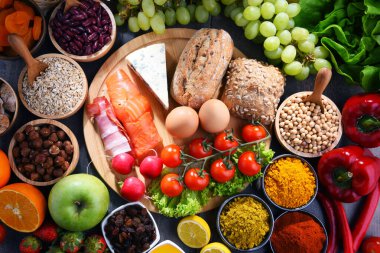 Assorted organic food products on the table clipart