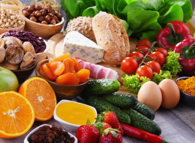 Assorted organic food products on the table clipart