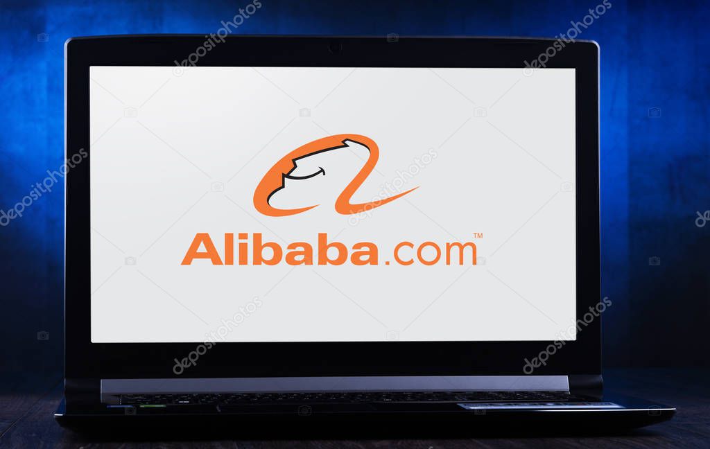POZNAN, POL - NOV 14, 2019: Laptop computer displaying logo of Alibaba, a Chinese multinational conglomerate holding company specializing in e-commerce, retail, Internet, and technology