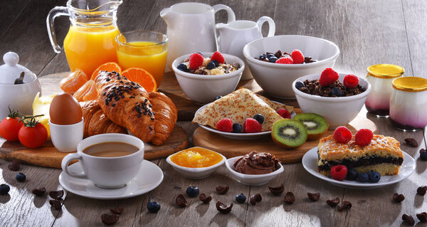 Breakfast served with coffee, juice, croissants and fruits