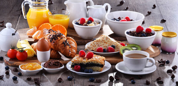 Breakfast served with coffee, juice, croissants and fruits