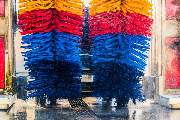 Car going through an automated car wash machine — Stock Photo, Image