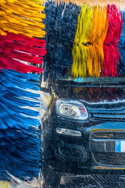 Car going through an automated car wash machine — Stock Photo, Image