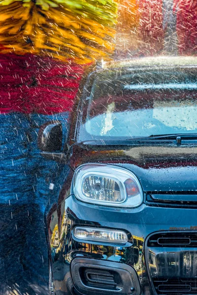 Car going through an automated car wash machine — Stock Photo, Image