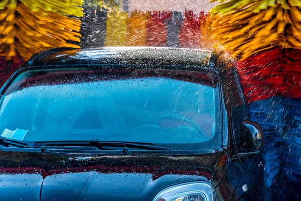 Car going through an automated car wash machine — Stock Photo, Image