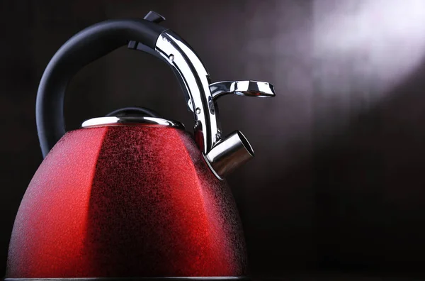 Red stainless steel stovetop kettle with whistle — Stock Photo, Image