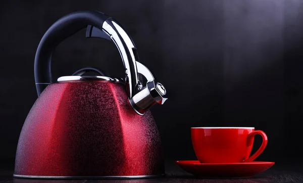 Red stainless steel stovetop kettle with whistle — Stock Photo, Image