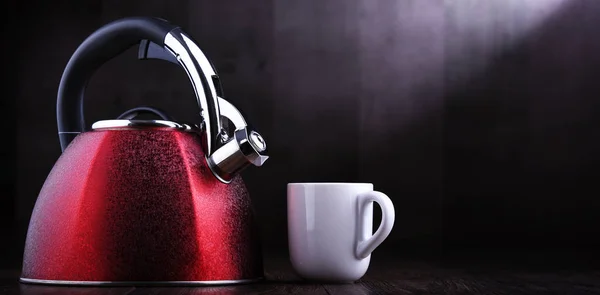 Red stainless steel stovetop kettle with whistle — Stock Photo, Image