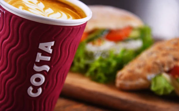 Cup of Costa coffee and sandwiches — 스톡 사진