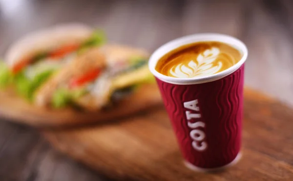 Cup of Costa coffee and sandwiches — 스톡 사진