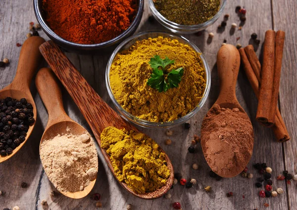 Variety of spices on kitchen table — Stock Photo, Image