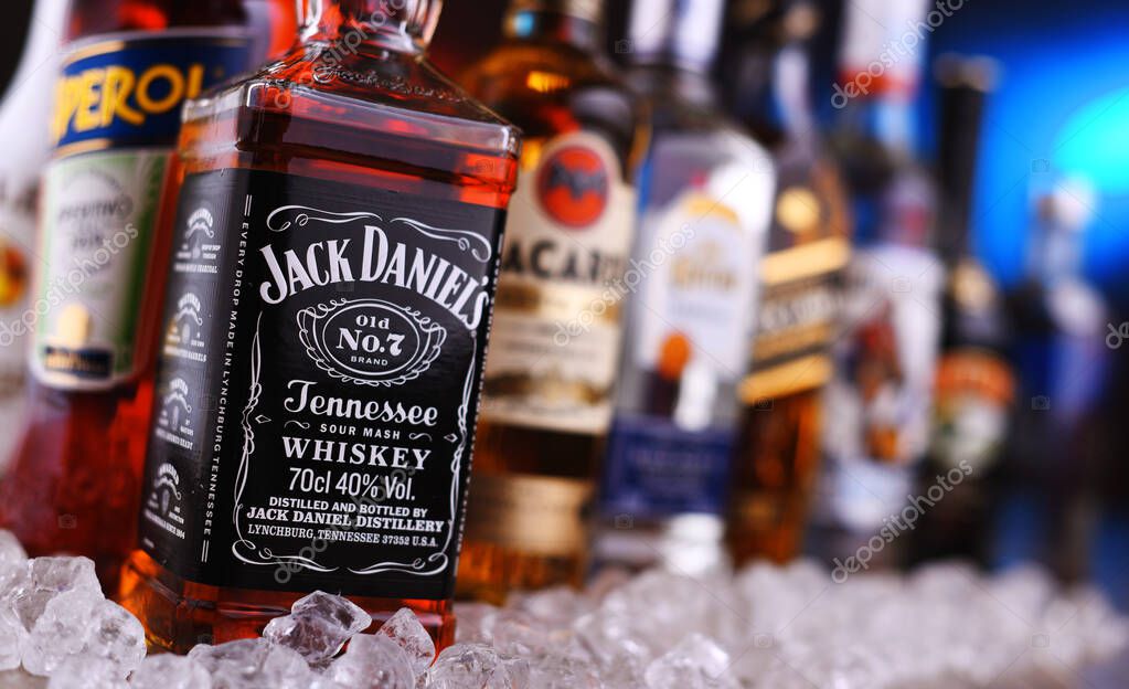 POZNAN, POLAND - DEC 20, 2019: Bottles of assorted global liquor brands including whiskey, vodka, gin and liqueur
