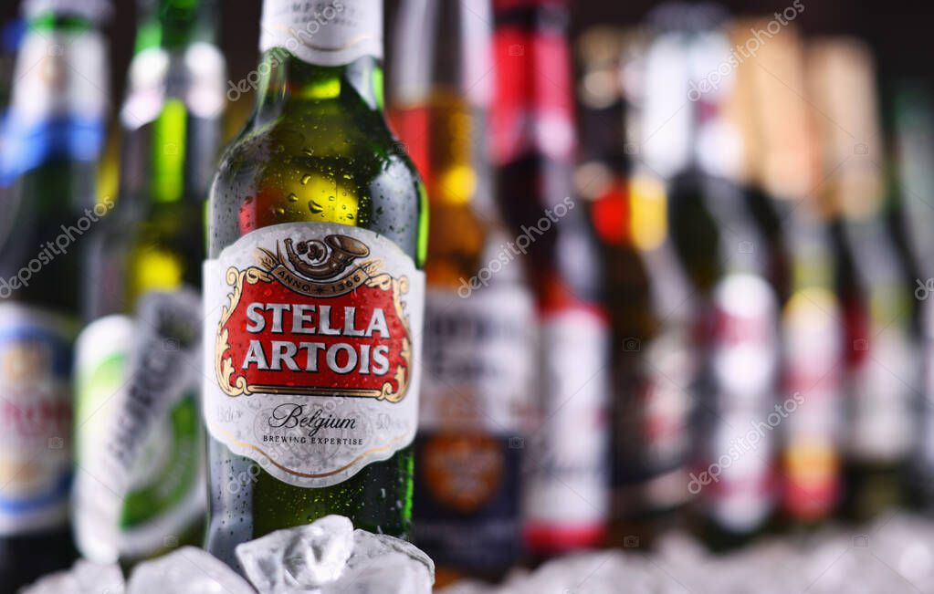 POZNAN, POL - DEC 23, 2019: Bottles of famous global beer brands including Heineken, Becks, Bud, Miller, Corona, Stella Artois, and Pilsner Urquell