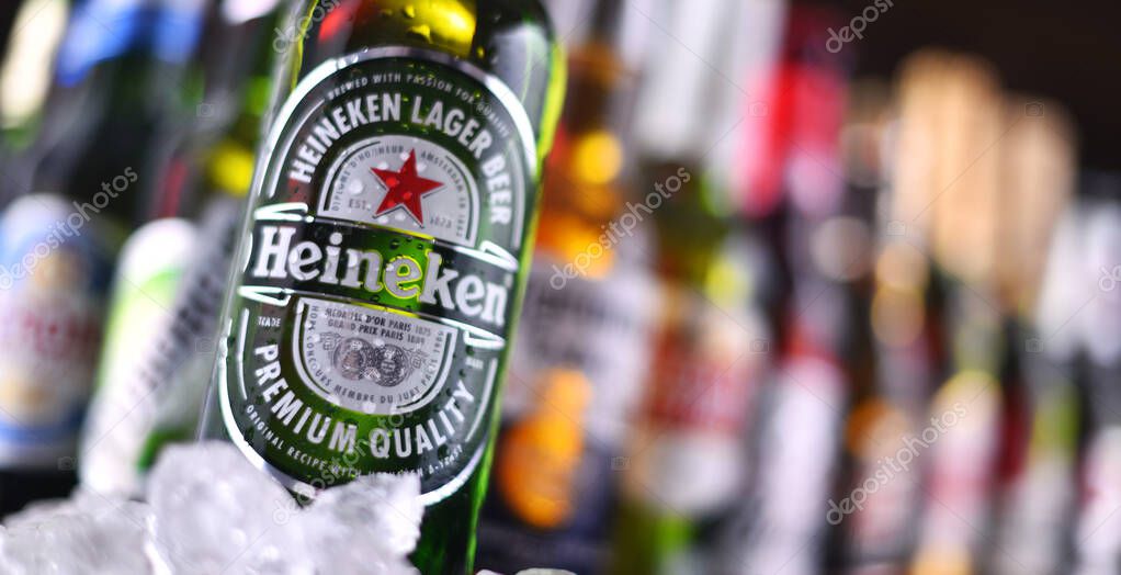 POZNAN, POL - DEC 23, 2019: Bottles of famous global beer brands including Heineken, Becks, Bud, Miller, Corona, Stella Artois, and Pilsner Urquell