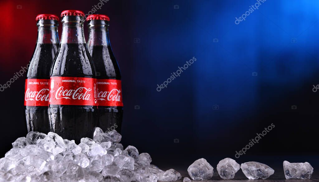 POZNAN, POL - DEC 27, 2019: Bottles of Coca-Cola, a carbonated soft drink manufactured by The Coca-Cola Company headquartered in Atlanta, Georgia, USA