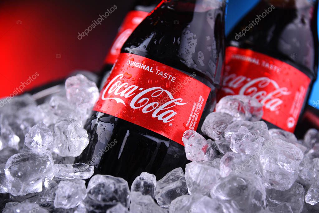 POZNAN, POL - DEC 27, 2019: Bottles of Coca-Cola, a carbonated soft drink manufactured by The Coca-Cola Company headquartered in Atlanta, Georgia, USA