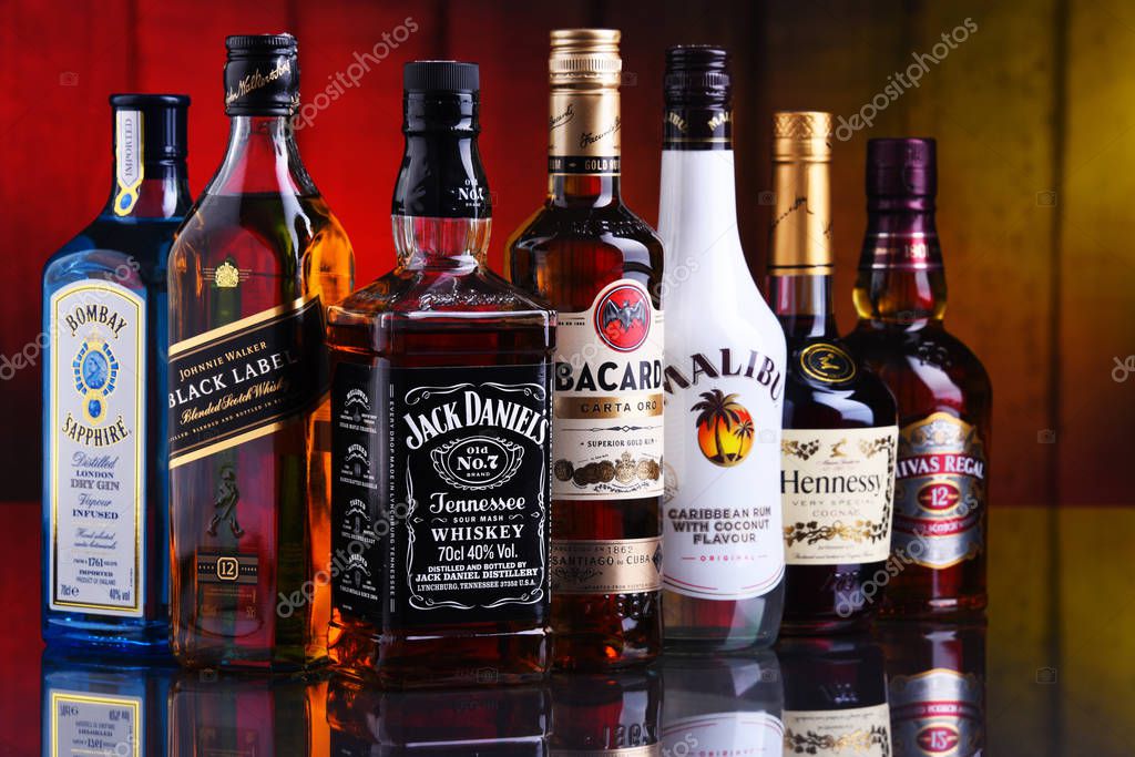 POZNAN, POL - JAN 10, 2020: Bottles of assorted global liquor brands including whiskey, vodka, gin and liqueur