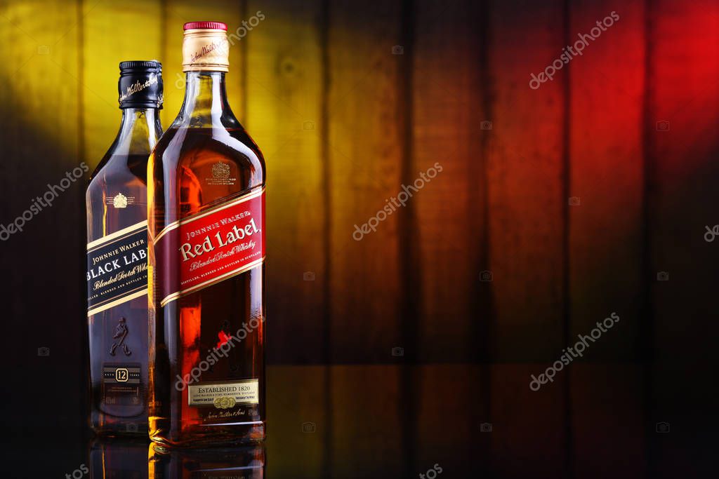 POZNAN, POL - JAN 10, 2020: Bottles of Johnnie Walker, the most widely distributed brand of blended Scotch whisky in the world with sales of over 130 million bottles a year.