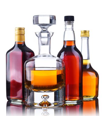 Bottles of assorted alcoholic beverages. clipart