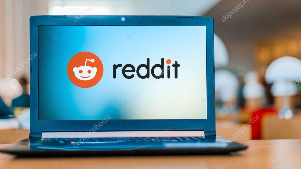 POZNAN, POL - DEC 11, 2019: Laptop computer displaying logo of Reddit, an American social news aggregation, web content rating, and discussion website